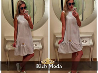 Платье свободного кроя 42-48, украшено фирменной лейбой Rich Moda , по